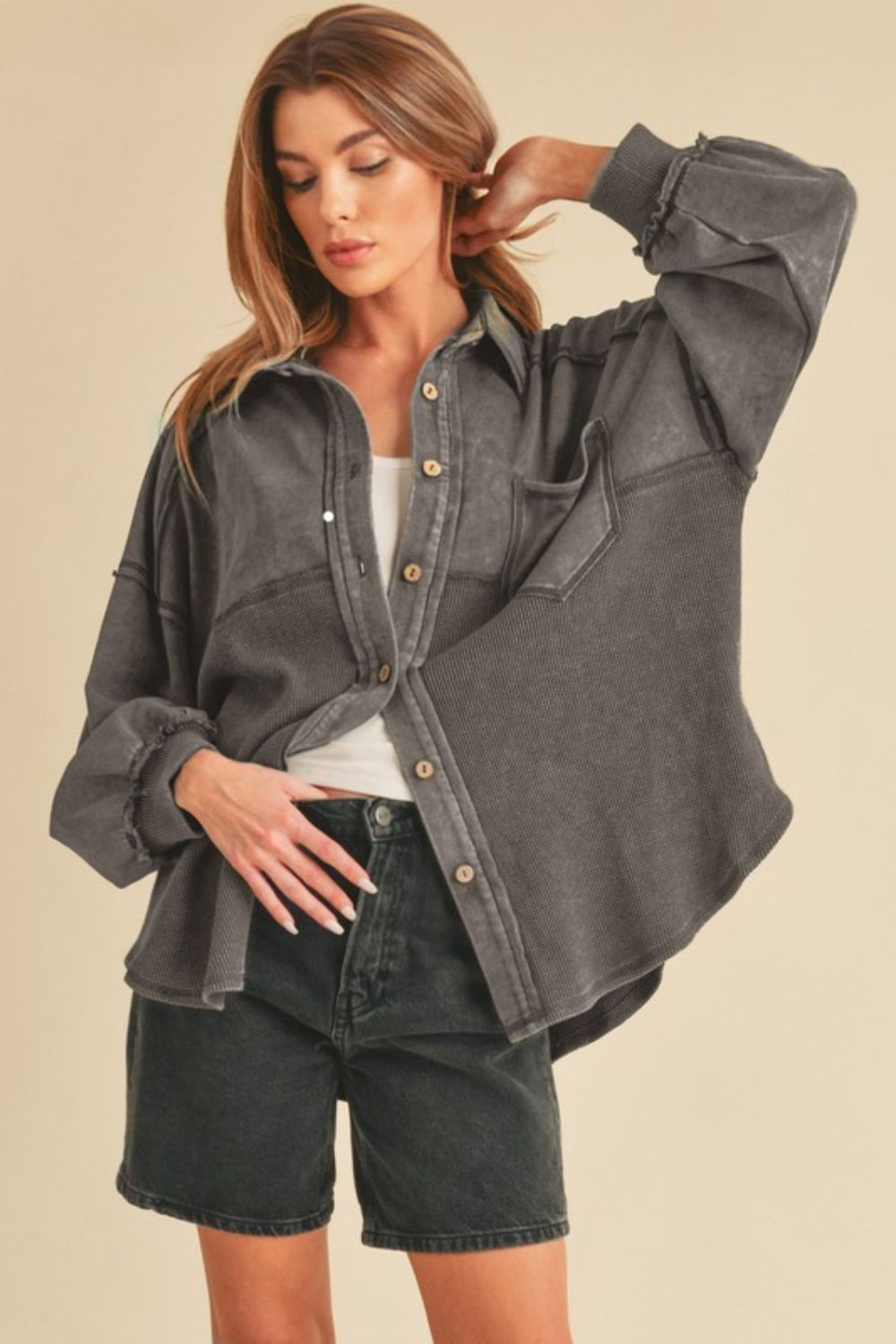 Stylish acid-washed button-up jacket with exposed seam detailing and a vintage-inspired worn-in look.