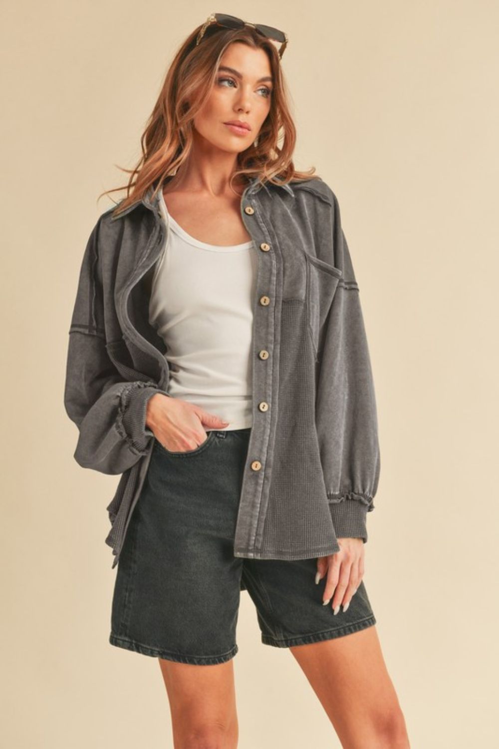 Stylish acid-washed button-up jacket with exposed seam detailing and a vintage-inspired worn-in look.