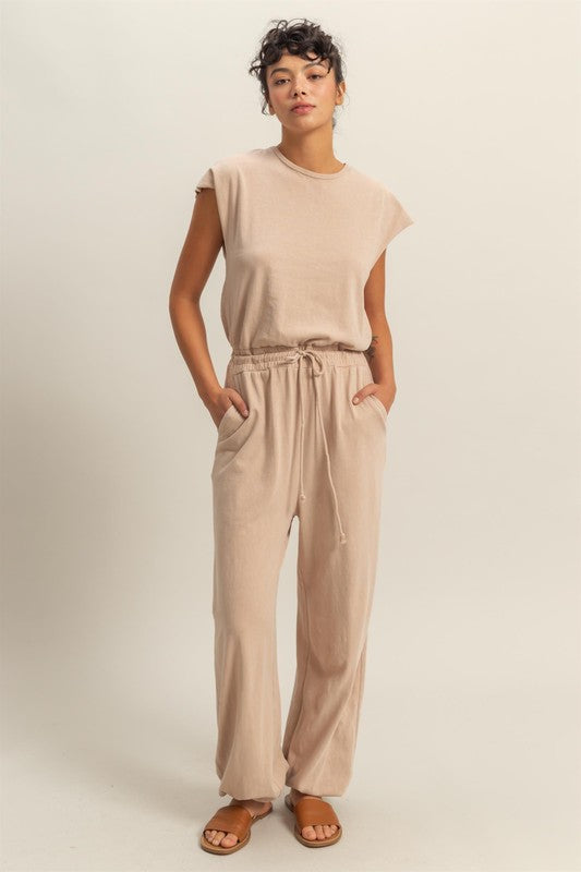 Chic back keyhole jumpsuit with cap sleeves and a drawstring waist for a stylish and comfortable look.