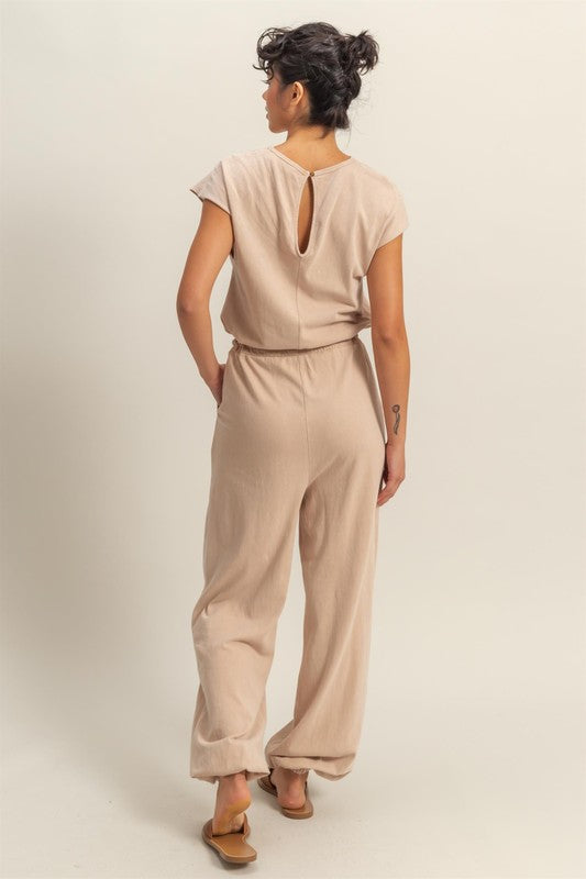 Chic back keyhole jumpsuit with cap sleeves and a drawstring waist for a stylish and comfortable look.