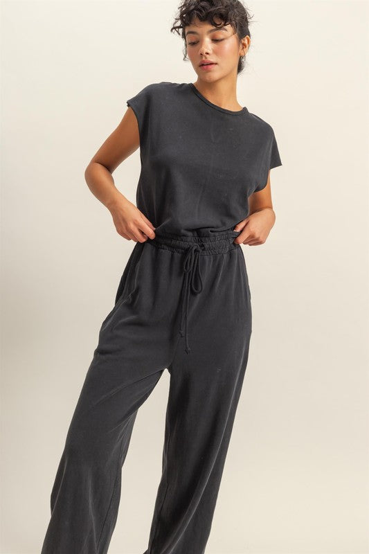 Chic back keyhole jumpsuit with cap sleeves and a drawstring waist for an effortless, stylish look