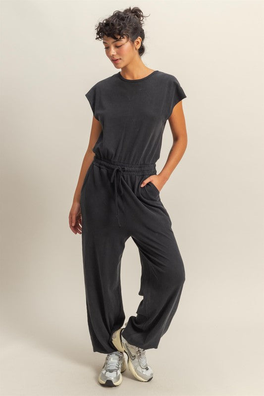 Chic back keyhole jumpsuit with cap sleeves and a drawstring waist for an effortless, stylish look.