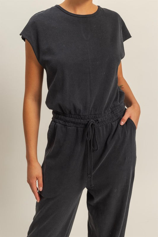 Chic back keyhole jumpsuit with cap sleeves and a drawstring waist for an effortless, stylish look.