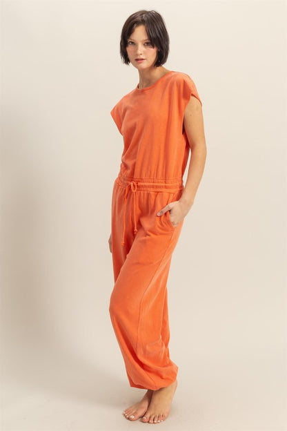 Back keyhole round neck cap sleeve drawstring jumpsuit with a flattering fit and pockets for effortless style and comfort.