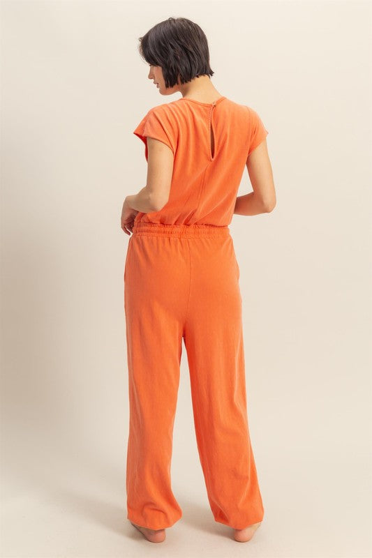 Back keyhole round neck cap sleeve drawstring jumpsuit with a flattering fit and pockets for effortless style and comfort.