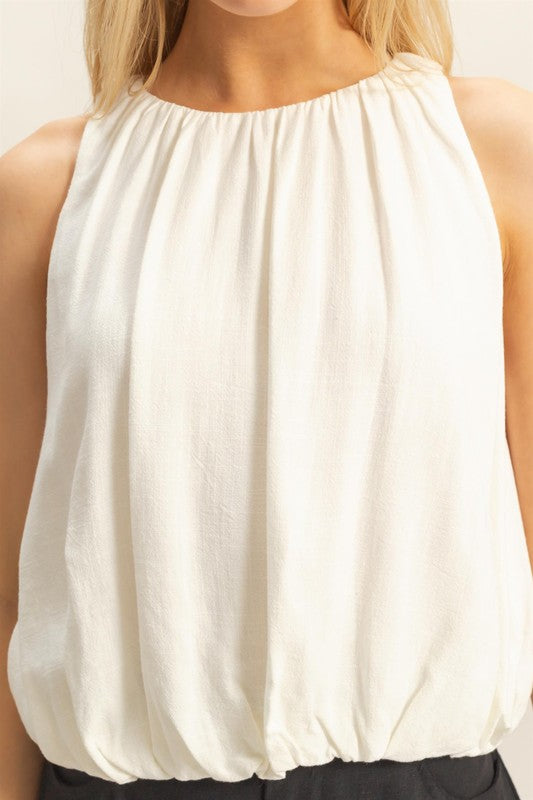 Bubble hem round neck sleeveless blouse with a stylish and relaxed fit, perfect for any occasion.