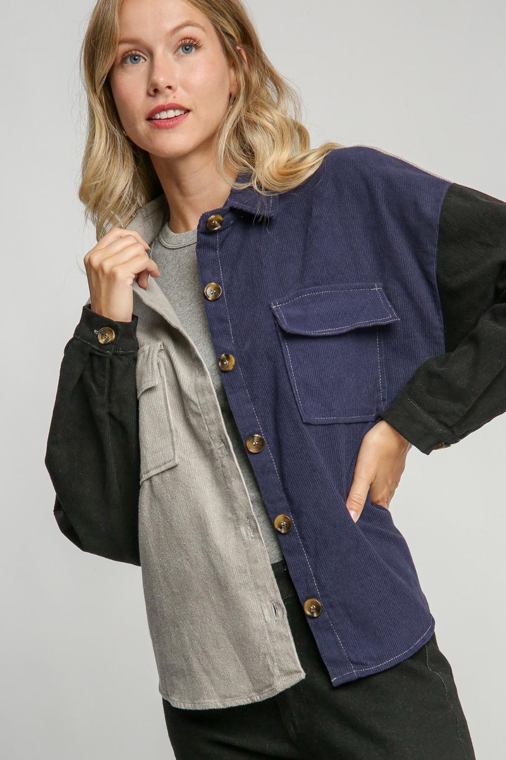 Trendy full-size color block button-down jacket with a modern design, featuring functional pockets and a comfortable fabric blend.