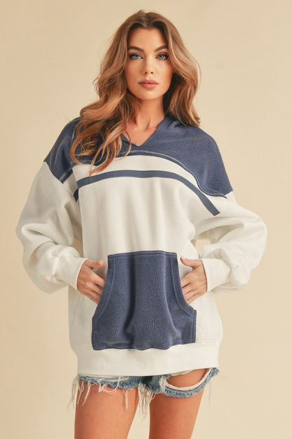 Trendy color block drop shoulder hoodie with a cozy kangaroo pocket, perfect for casual and stylish wear.