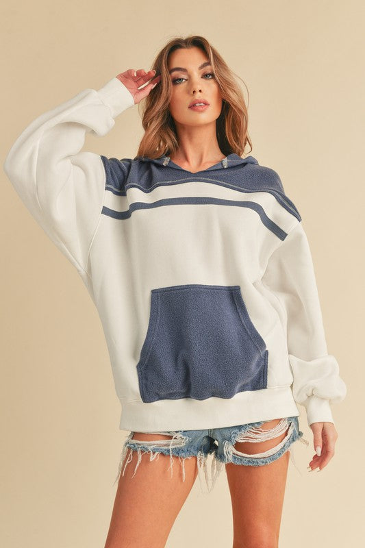 Trendy color block drop shoulder hoodie with a cozy kangaroo pocket, perfect for casual and stylish wear.