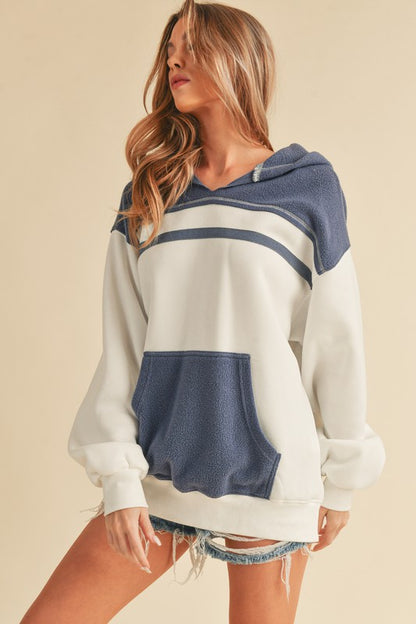 Trendy color block drop shoulder hoodie with a cozy kangaroo pocket, perfect for casual and stylish wear.