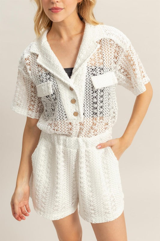 Crochet button front short sleeve romper with bohemian-inspired details, perfect for summer.