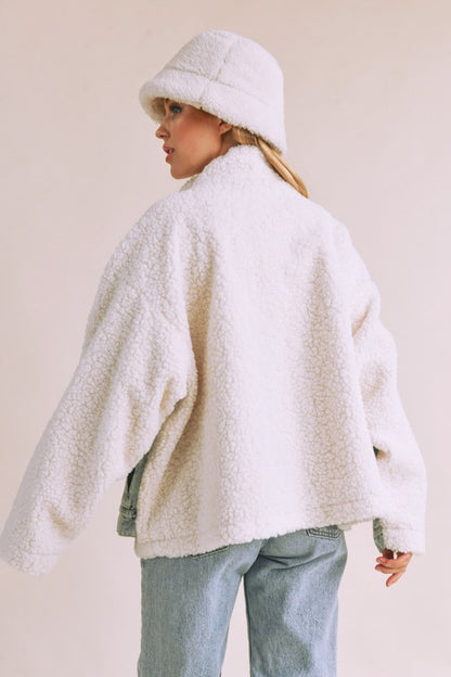 Stylish denim washed drop shoulder sherpa jacket with a faux two-piece effect, perfect for a cozy and trendy layered look.