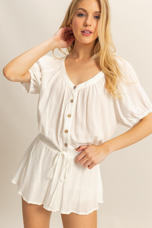 Trendy drawstring hem short sleeve top and matching skort set in lightweight fabric, perfect for a casual chic look.