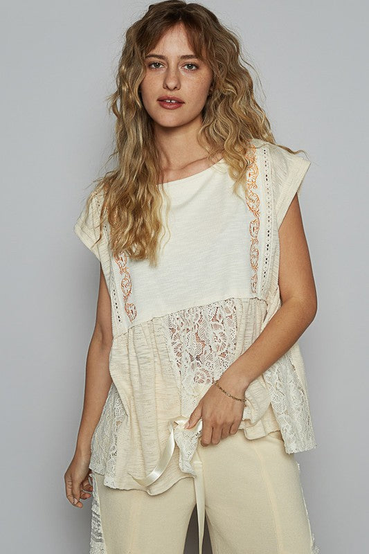 Women's embroidered lace blouse with boat neckline, cap sleeves, and peplum hem – chic and elegant