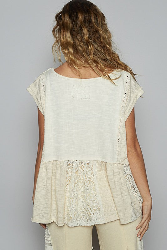 Women's embroidered lace blouse with boat neckline, cap sleeves, and peplum hem – chic and elegant