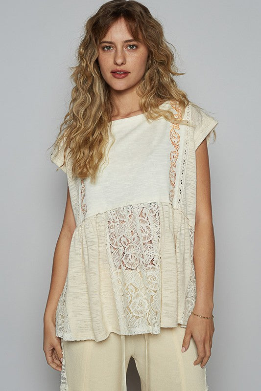 Women's embroidered lace blouse with boat neckline, cap sleeves, and peplum hem – chic and elegant