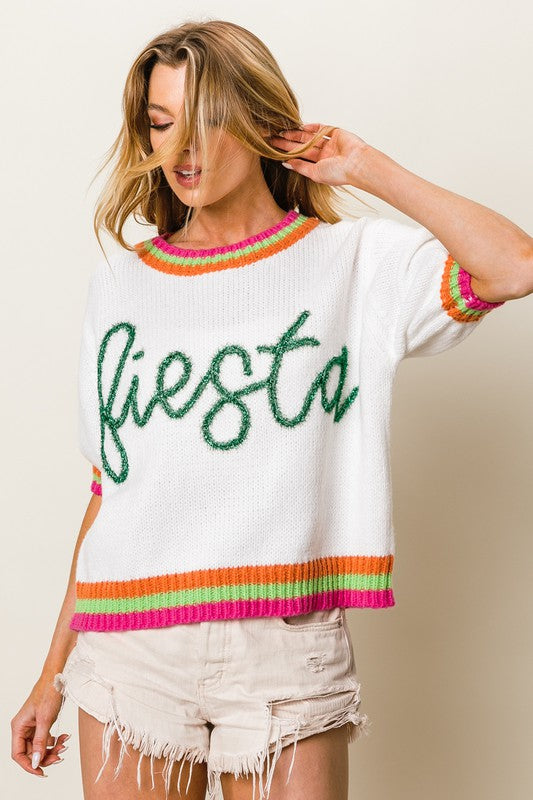 Stylish FIESTA metallic letter sweater with short puff sleeves, adding a bold and trendy touch to any outfit.