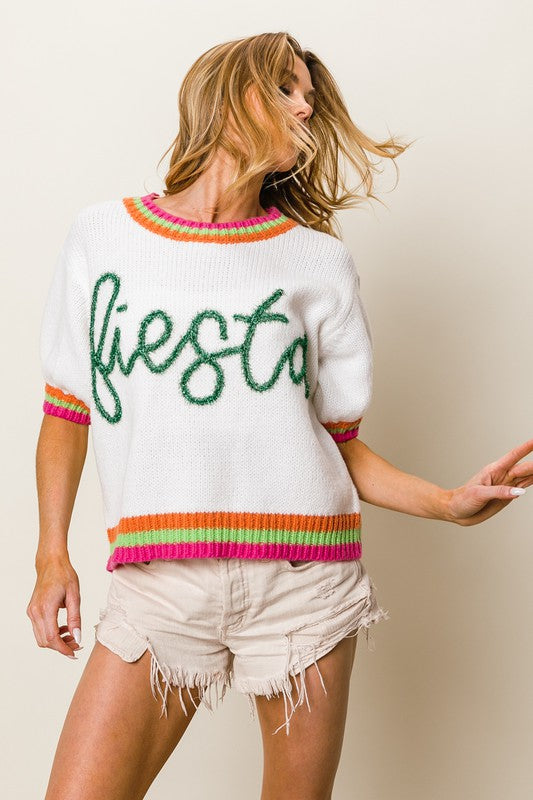 Stylish FIESTA metallic letter sweater with short puff sleeves, adding a bold and trendy touch to any outfit.