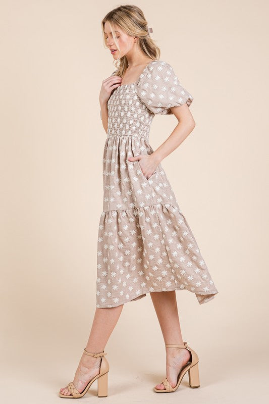 Floral embroidered smocked puff sleeve tiered midi dress with feminine & elegant details.