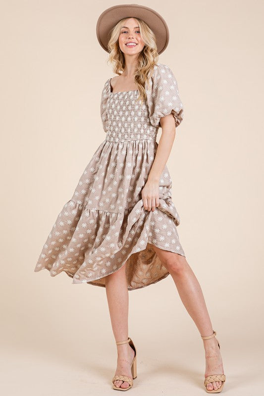 Floral embroidered smocked puff sleeve tiered midi dress with feminine & elegant details.