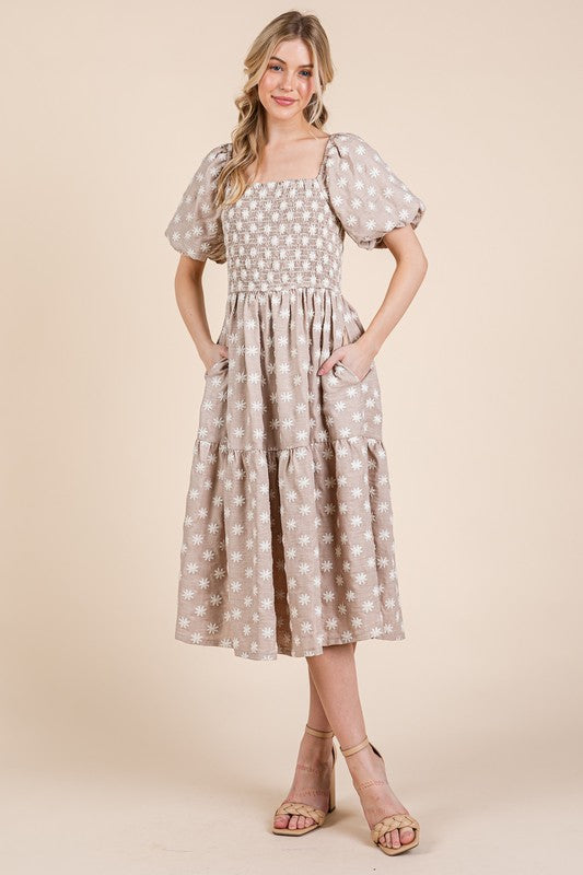 Floral embroidered smocked puff sleeve tiered midi dress with feminine & elegant details.