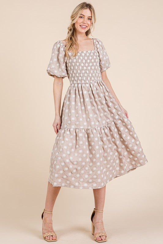 Floral embroidered smocked puff sleeve tiered midi dress with feminine & elegant details.