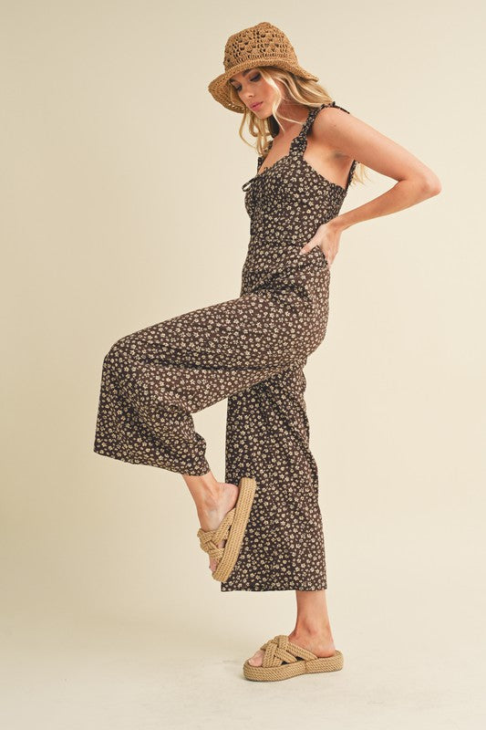 Elegant floral jumpsuit with a sweetheart neckline and wide-leg silhouette for a stylish and feminine look.