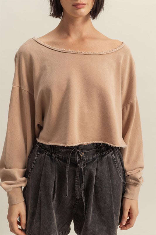 Trendy frayed detail boat neck long sleeve crop top in 100% cotton, perfect for an edgy street-style look.