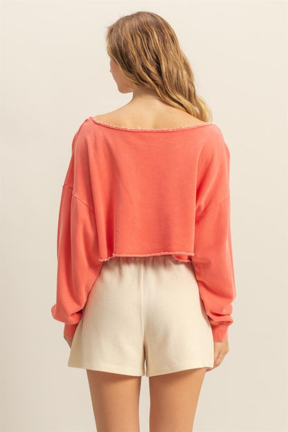 Frayed detail boat neck long sleeve crop top with raw edges, stylish & edgy for casual wear.