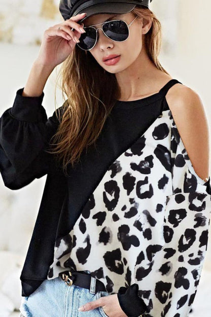 Stylish French terry leopard cold shoulder top with a trendy cutout design, perfect for casual chic outfits.