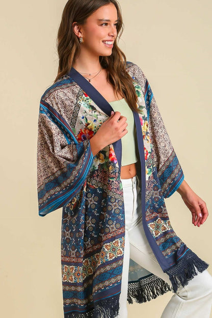 Boho-chic fringe hem open front kimono cover-up with a vibrant print, perfect for layering over casual and beachwear.