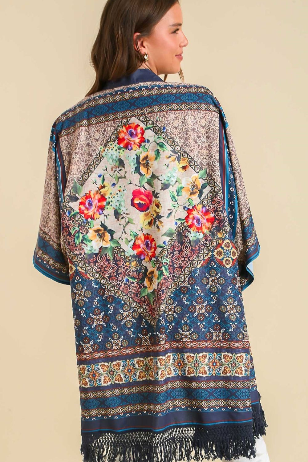 Boho-chic fringe hem open front kimono cover-up with a vibrant print, perfect for layering over casual and beachwear.