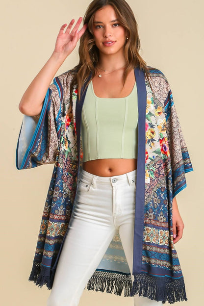 Boho-chic fringe hem open front kimono cover-up with a vibrant print, perfect for layering over casual and beachwear.