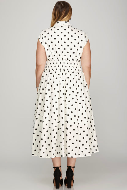 Front zip polka dot midi dress with cap sleeves, featuring a flattering smocked waist and classic vintage charm.