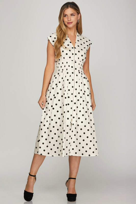 Front zip polka dot midi dress with cap sleeves, featuring a flattering smocked waist and classic vintage charm.