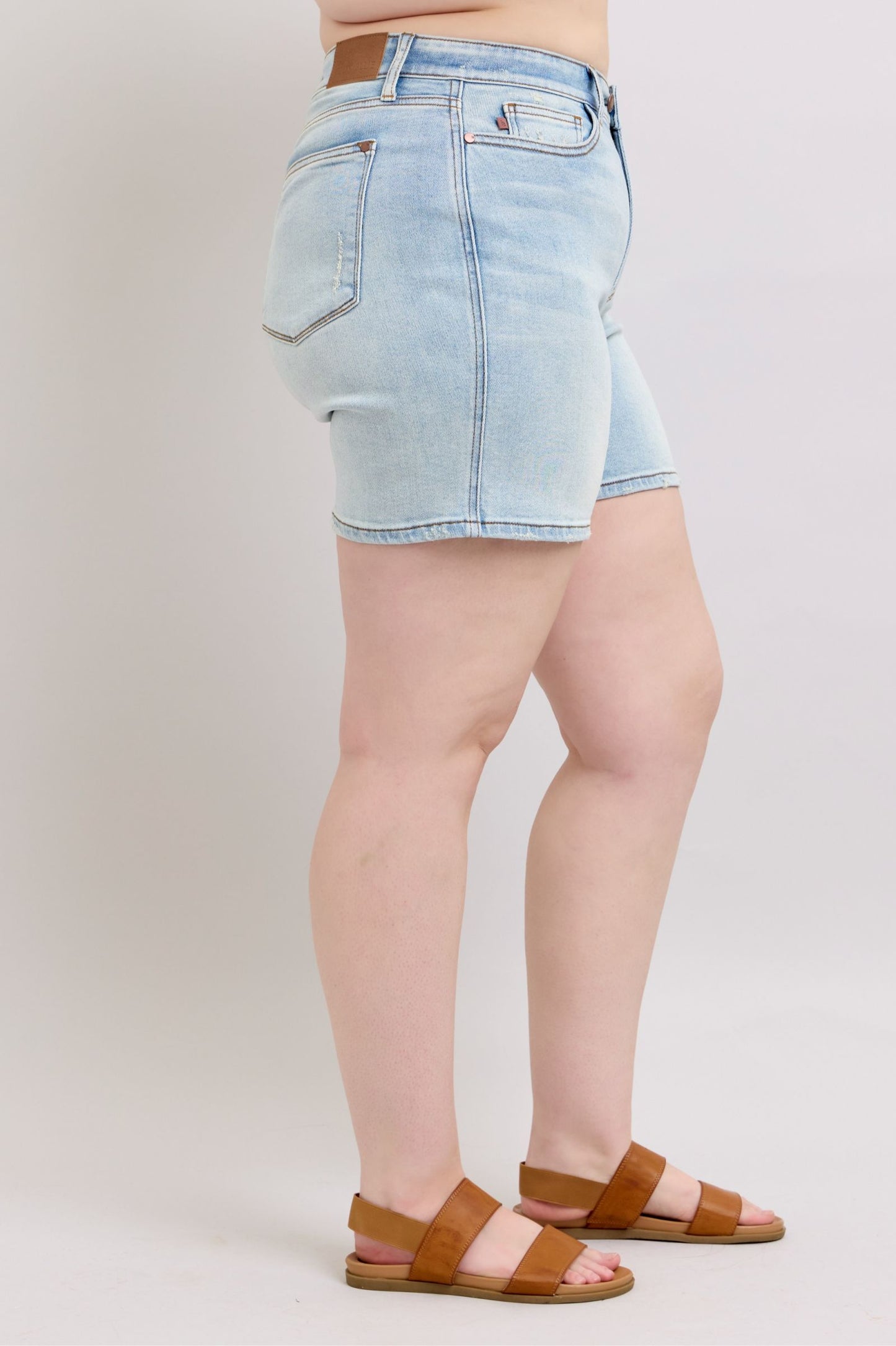 Plus-size full-length 2-button denim shorts with pockets, designed for comfort & casual summer style.