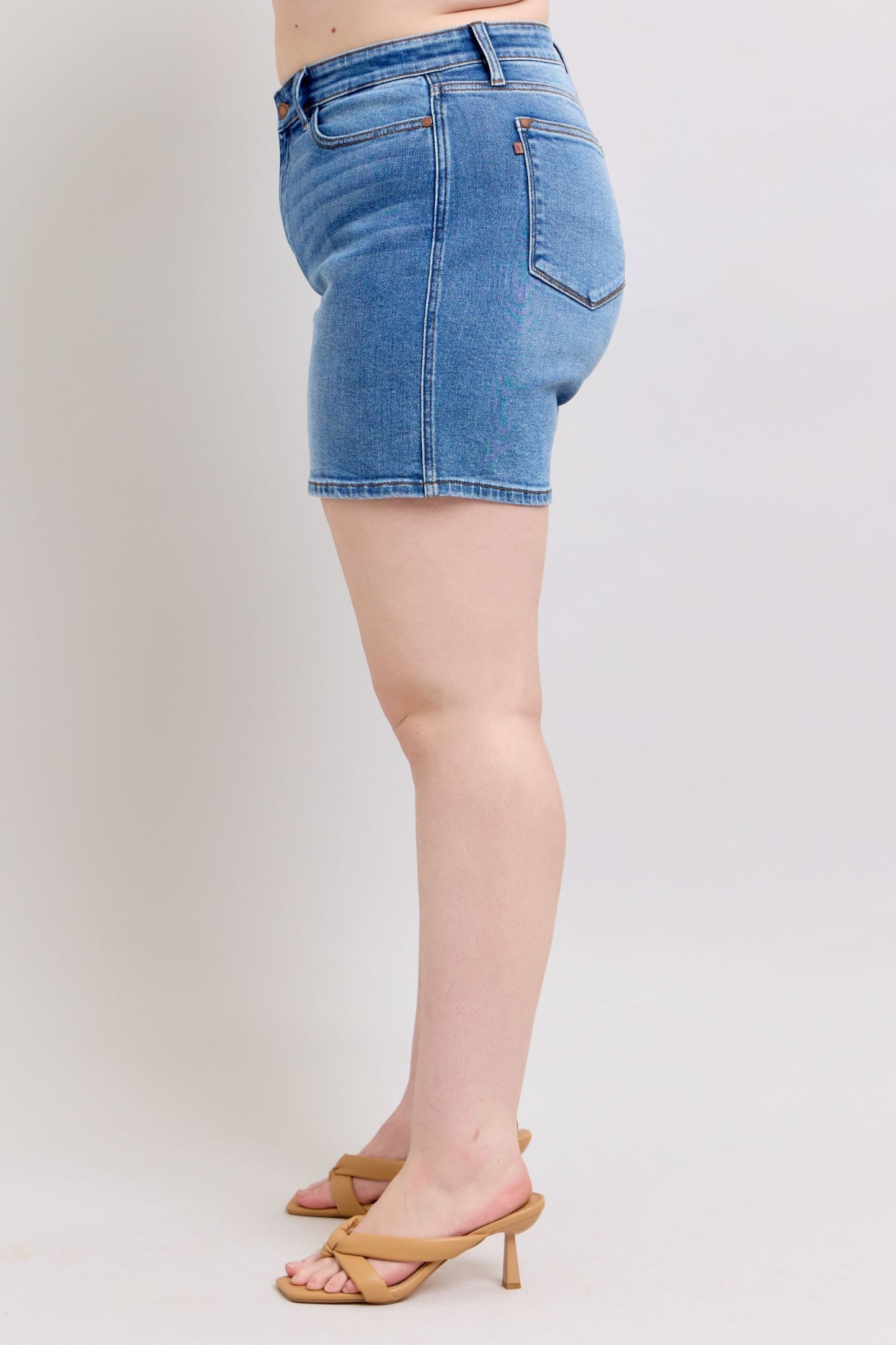 Full-size 2-button denim shorts with pockets, featuring a high-rise waist & moderate stretch for a comfortable & stylish summer look.