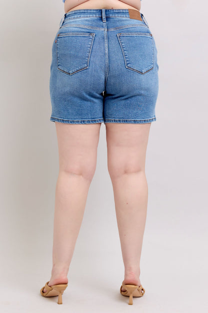 Full-size 2-button denim shorts with pockets, featuring a high-rise waist & moderate stretch for a comfortable & stylish summer look.