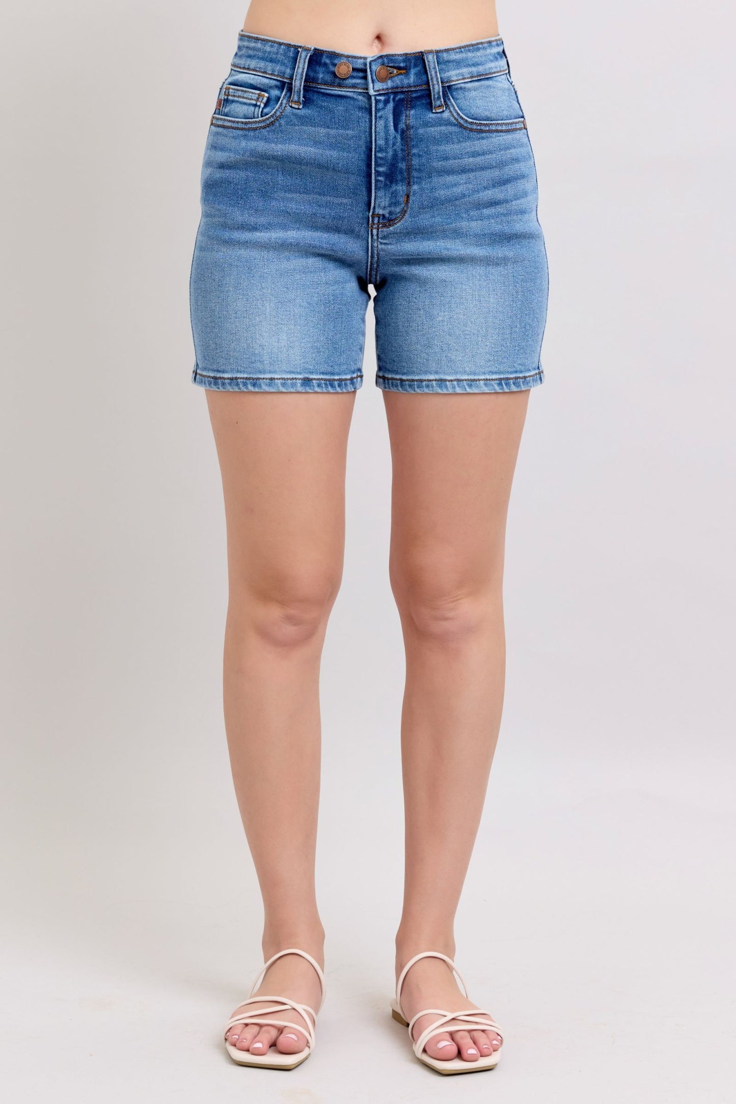 Full-size 2-button denim shorts with pockets, featuring a high-rise waist & moderate stretch for a comfortable & stylish summer look.