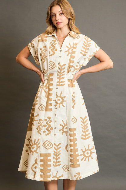 Abstract print midi dress with an elastic waist and soft fabric, designed for stylish and flattering plus-size comfort.