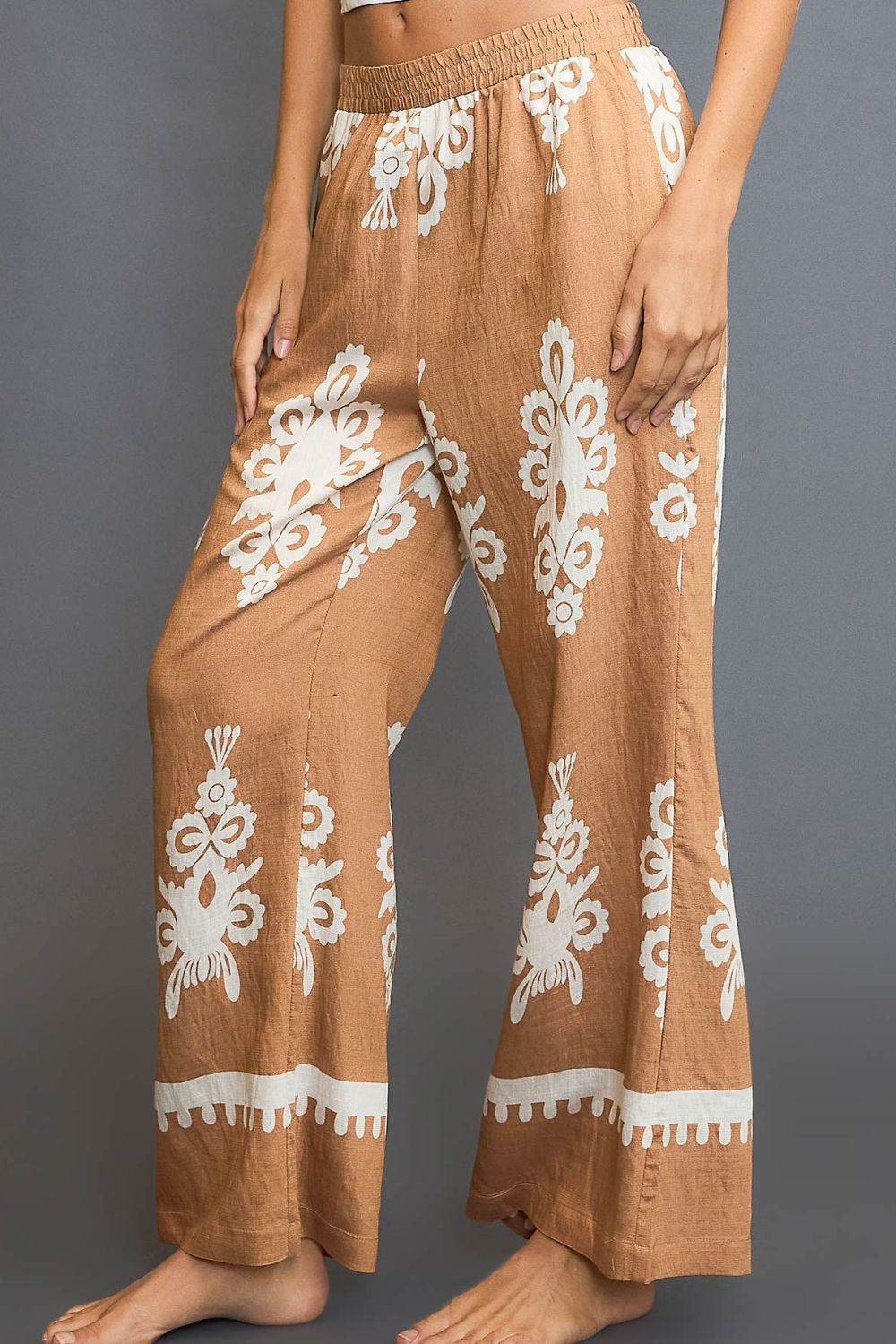 Bold border print wide-leg pants with a flattering fit, perfect for stylish and versatile outfits.