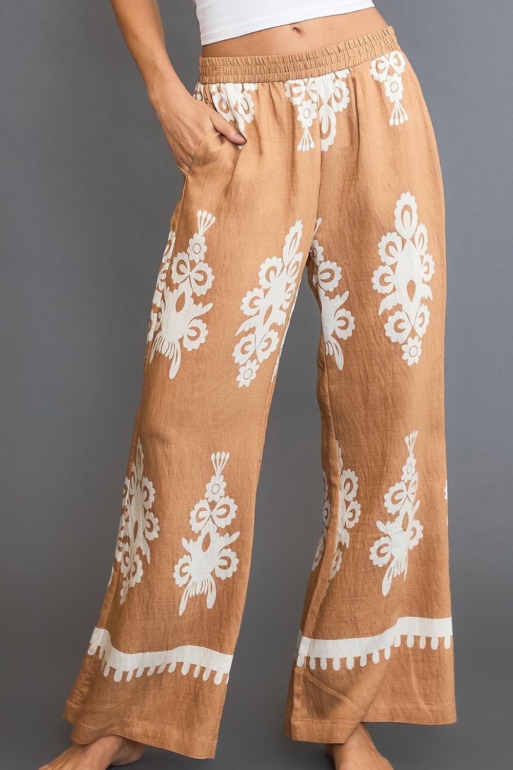 Bold border print wide-leg pants with a flattering fit, perfect for stylish and versatile outfits.