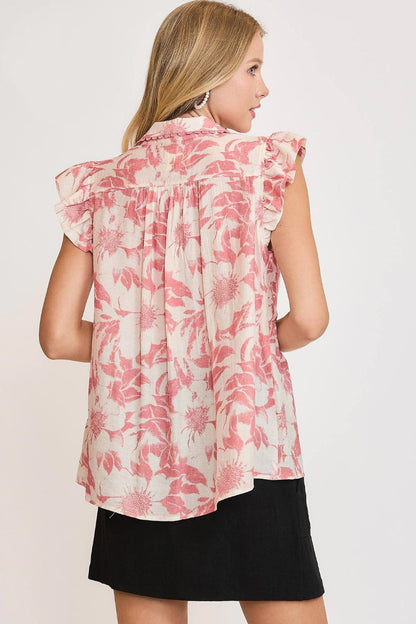 Flowy botanical print babydoll top with ruffled details, perfect for a casual and feminine look.