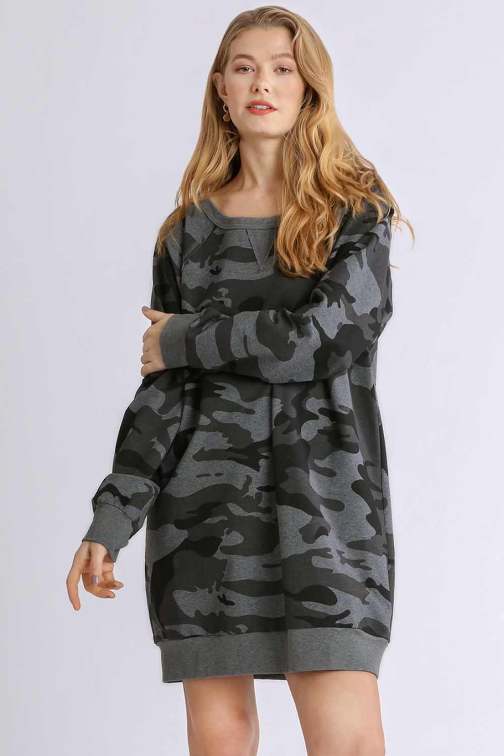 Stylish camo print French terry mini dress with ribbed hem detailing for a trendy and casual look.