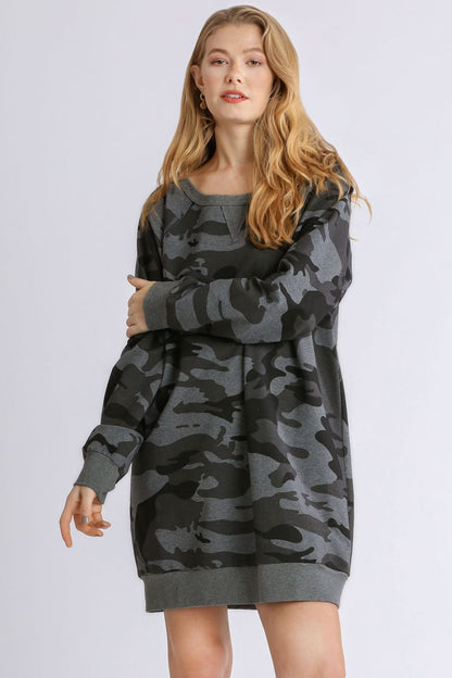 Stylish camo print French terry mini dress with ribbed hem detailing for a trendy and casual look.