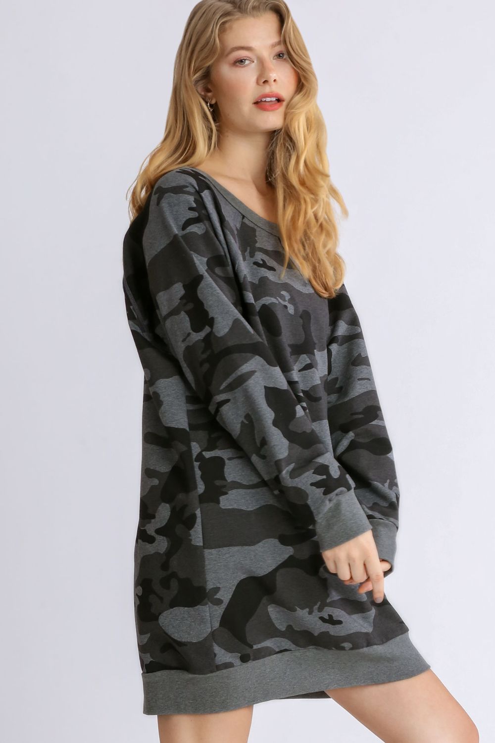 Stylish camo print French terry mini dress with ribbed hem detailing for a trendy and casual look.