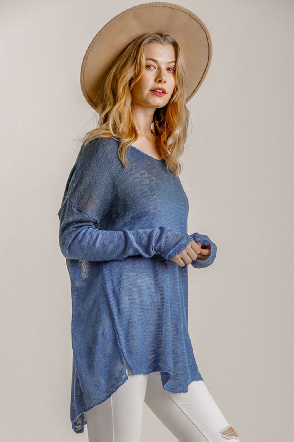 Stylish dip dye loose knit top with high-low side slits, perfect for a relaxed and trendy casual look.