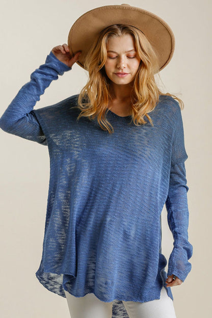 Stylish dip dye loose knit top with high-low side slits, perfect for a relaxed and trendy casual look.