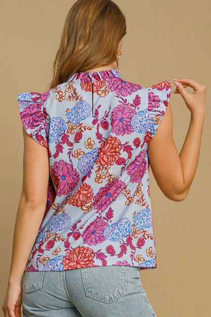 Floral print blouse with ruffled cap sleeves, offering a soft and feminine silhouette perfect for any occasion.