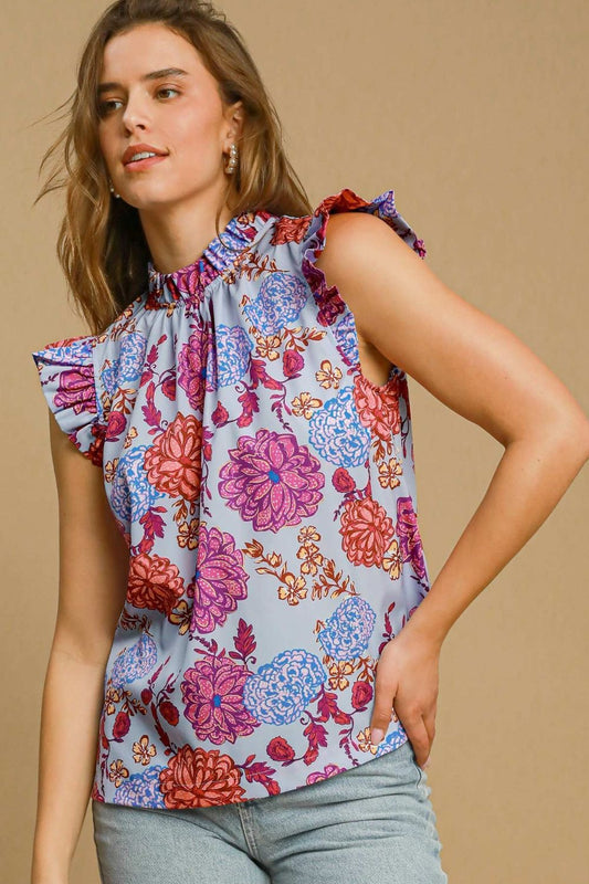 Floral print blouse with ruffled cap sleeves, offering a soft and feminine silhouette perfect for any occasion.